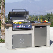 outdoor kitchen island with closed grill in the evening